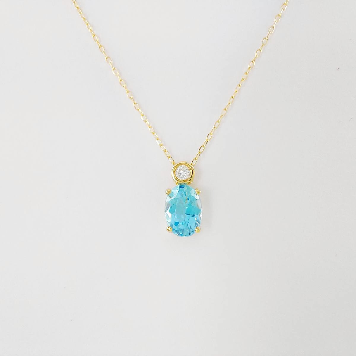 COLGANTE BRILLANTE 0,035 CT Y TOPACIO AZUL