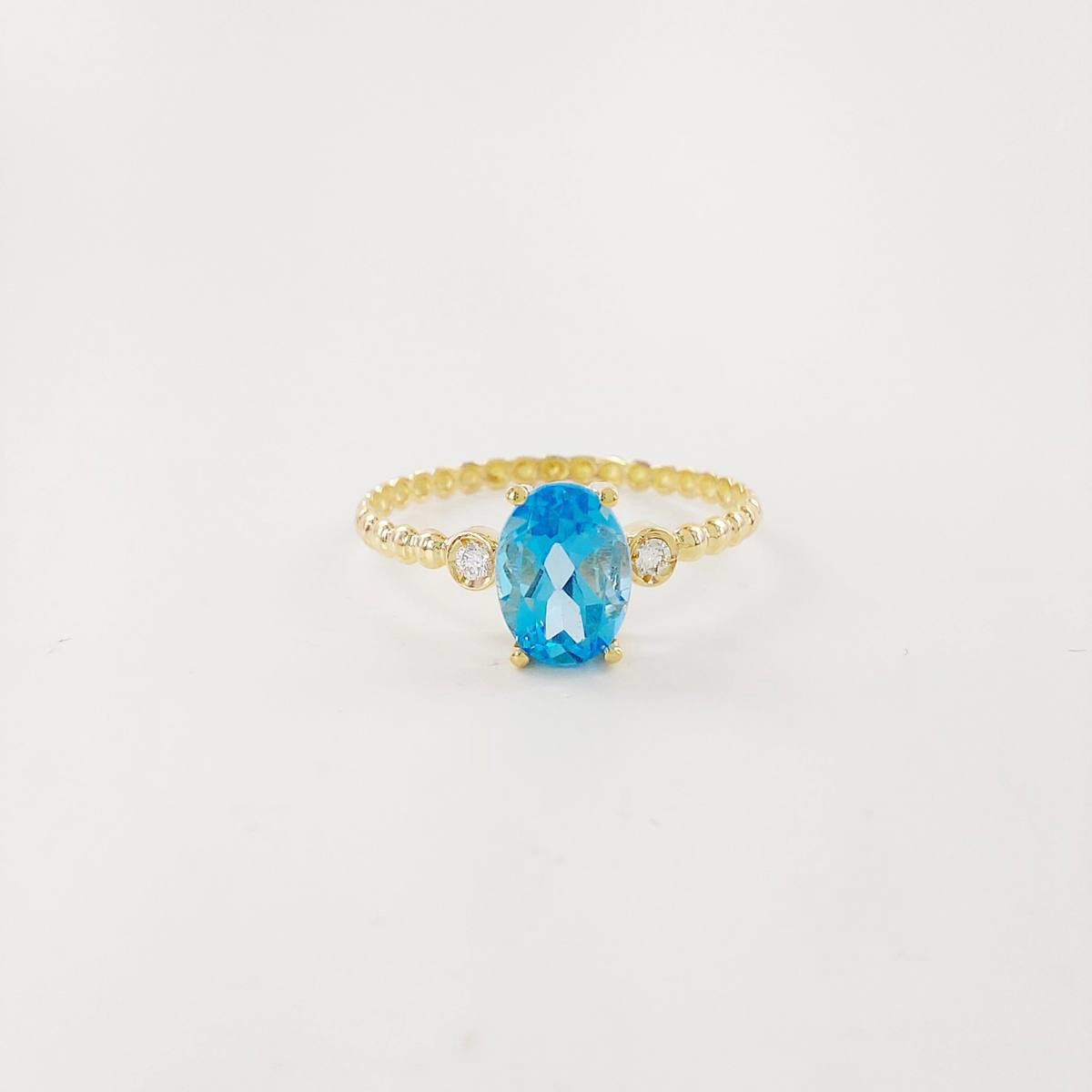 ANILLO BRILLANTE 0,03 CT Y TOPACIO AZUL