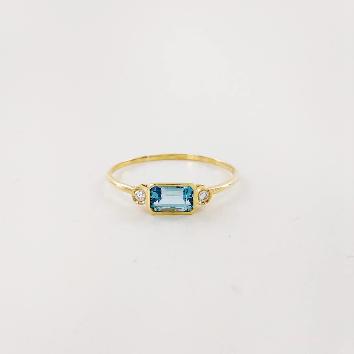ANILLO BRILLANTE 0,03 CT Y TOPACIO AZUL