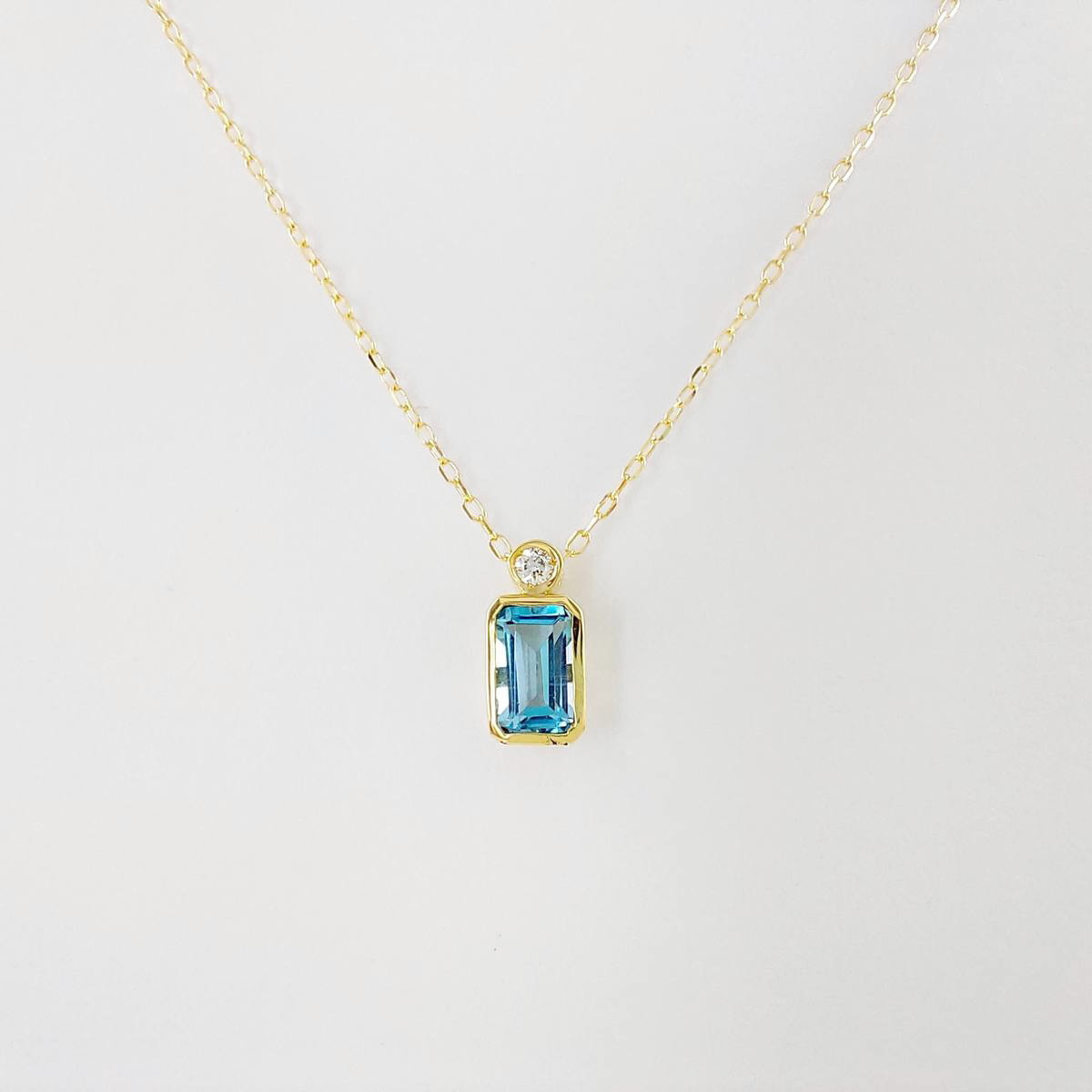 COLGANTE BRILLANTE 0,015 CT Y TOPACIO AZUL